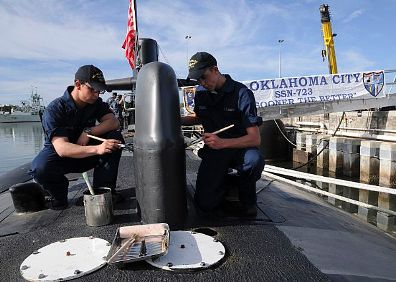 Seaman paint topside on the USS Oklahoma City (SSN 723)