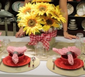 For simple, stylish centerpieces start with a metal bucket, add a few bunches of faux florals and finish off with a bow