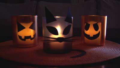 Colorful plastic glasses make great Halloween votive candle holders