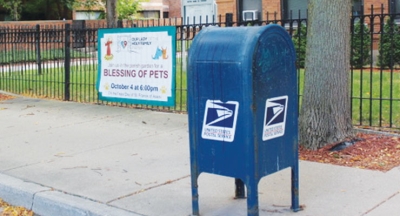 The USPS mailbox in front of Our Lady of the Holy Family Parish, located in Chicago, is among the many that have been robbed.