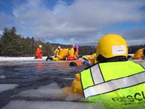 First Responders conducting an ice rescue under the supervision of a Lifesaving Resources