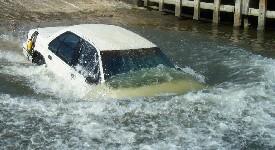 Vehicle submerging off boat ramp