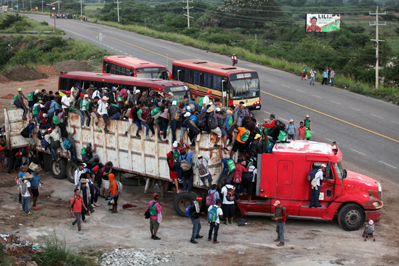 Migrants Getting onto a Truck Near the Border