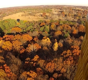 Michigan fall colors are spectacular flying OVER tree tops in a hot air balloon